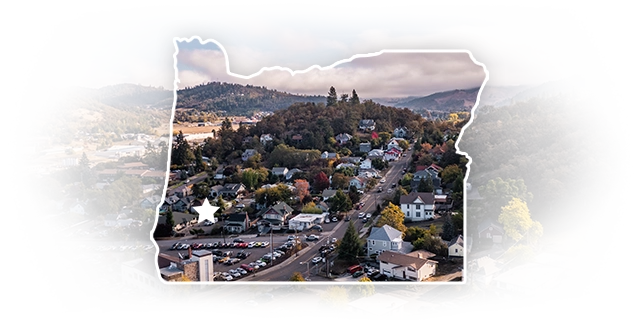 Roseburg cityscape masked in an Oregon shape